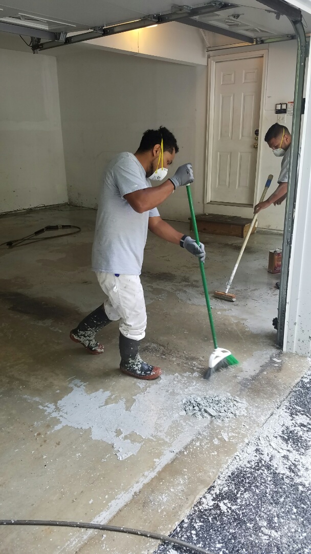 Removing Paint from and acid etching garage floor for customer in Woodbine Md.