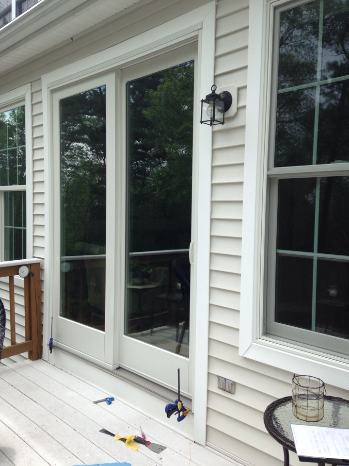 Plymouth, MA - Renewal by Andersen Boston inspecting patio door Plymouth, MA - Renewal by Andersen Boston inspecting patio door