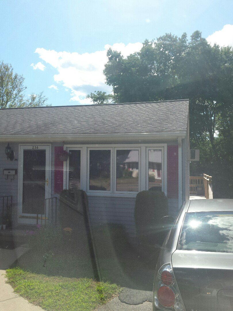 Framingham, MA - Renewal by Andersen of Boston helping a customer with screen Framingham, MA - Renewal by Andersen of Boston helping a customer with screen