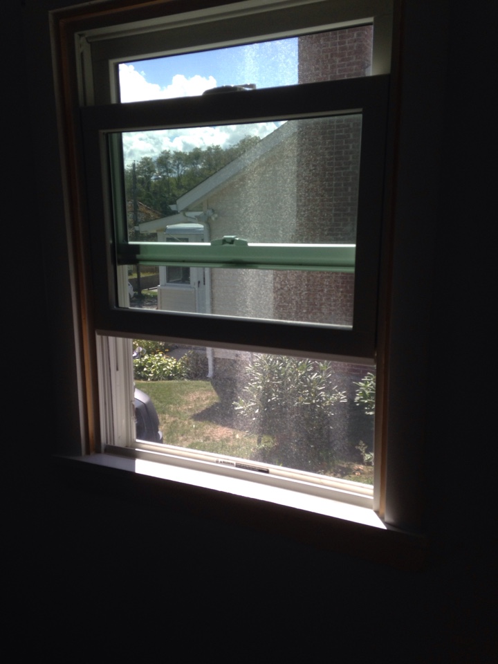 Plymouth, MA - Renewal by Andersen Boston inspecting a double hung Plymouth, MA - Renewal by Andersen Boston inspecting a double hung