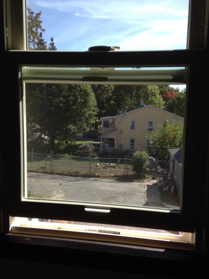Shrewsbury, MA - Renewal by Andersen Boston inspecting double hung unit Shrewsbury, MA - Renewal by Andersen Boston inspecting double hung unit