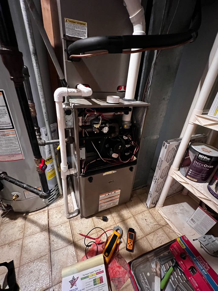 Hoffman Estates, IL - Performing annual furnace preventative maintenance check on York unit. Taking heat rise. Cleaning drain trap. Hoffman Estates, IL - Performing annual furnace preventative maintenance check on York unit. Taking heat rise. Cleaning drain trap.