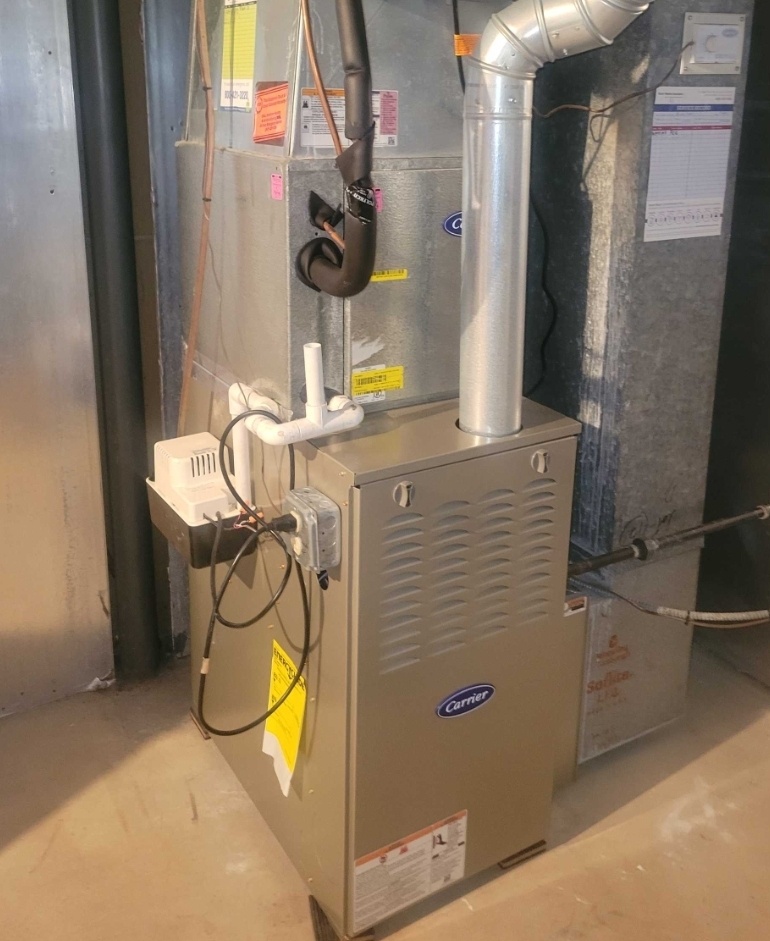 Schaumburg, IL - Completing a tune up on the gas furnace. Testing the efficiency and safety of the system with a no breakdown guarantee.  Schaumburg, IL - Completing a tune up on the gas furnace. Testing the efficiency and safety of the system with a no breakdown guarantee.