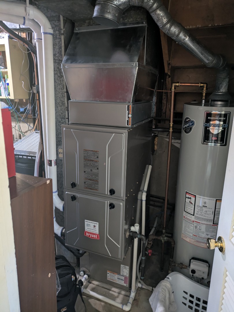 performing maintenance on a high efficiency Bryant system and humidifier  performing maintenance on a high efficiency Bryant system and humidifier
