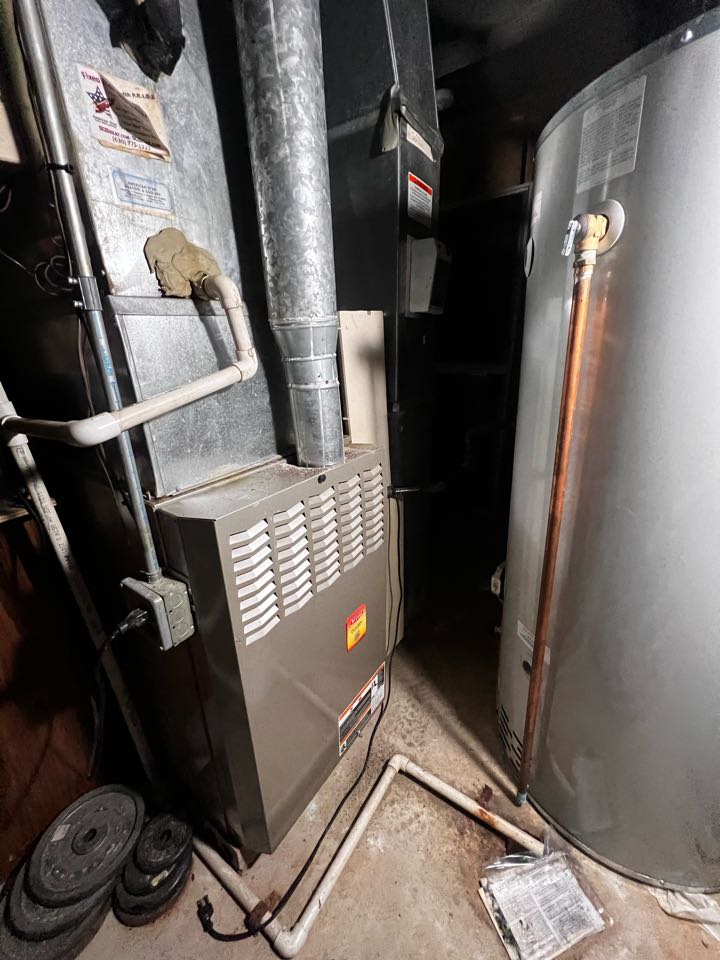 Bartlett, IL - Performing annual furnace clean & check. Taking a combustion analysis reading. Checking heat rise. Bartlett, IL - Performing annual furnace clean & check. Taking a combustion analysis reading. Checking heat rise.