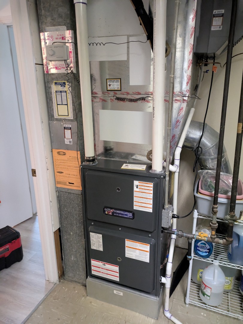 performing maintenance on a high efficiency Goodman Amana system and large fan powered humidifier 