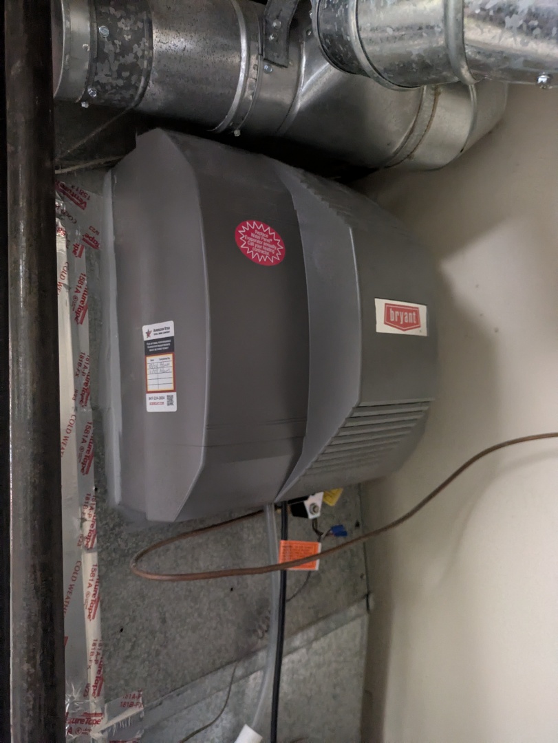 performing maintenance on a high efficiency Goodman Amana system and large fan powered humidifier 