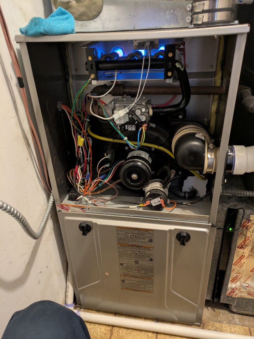 performing maintenance on a high efficiency Bryant system and large fan powered humidifier 