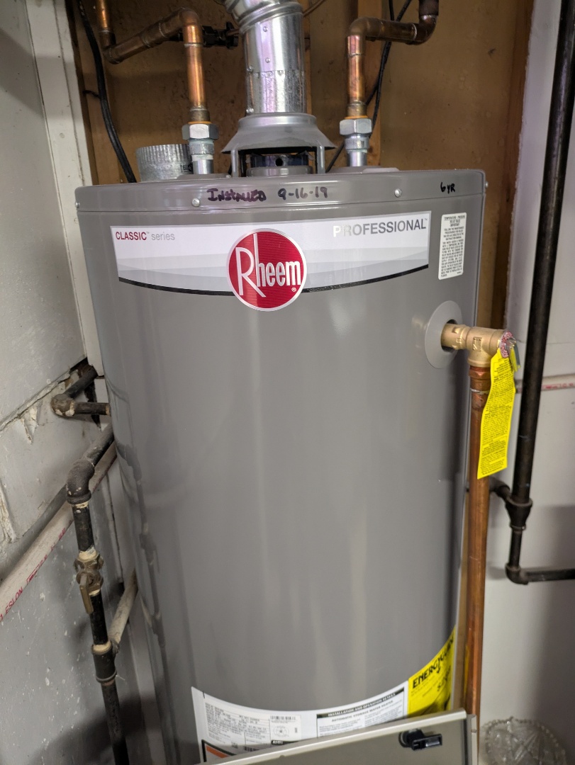 performing maintenance on a Bryant system and checking Rheem water heater 
