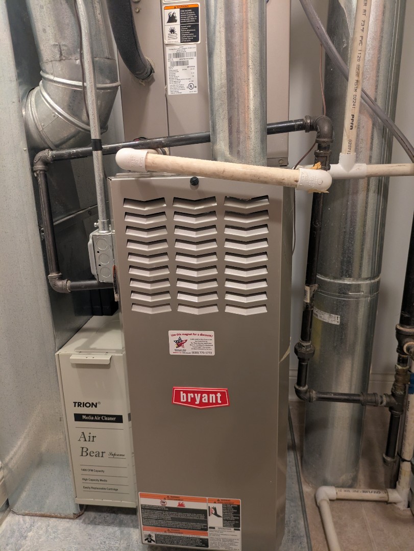 performing maintenance on a Bryant system and humidifier, also did a water heater flush 