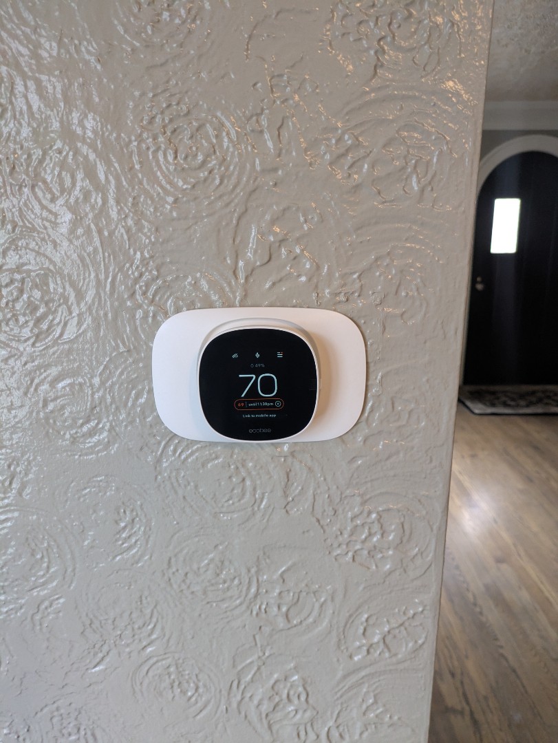 performing maintenance and installing 2 new smart thermostat 