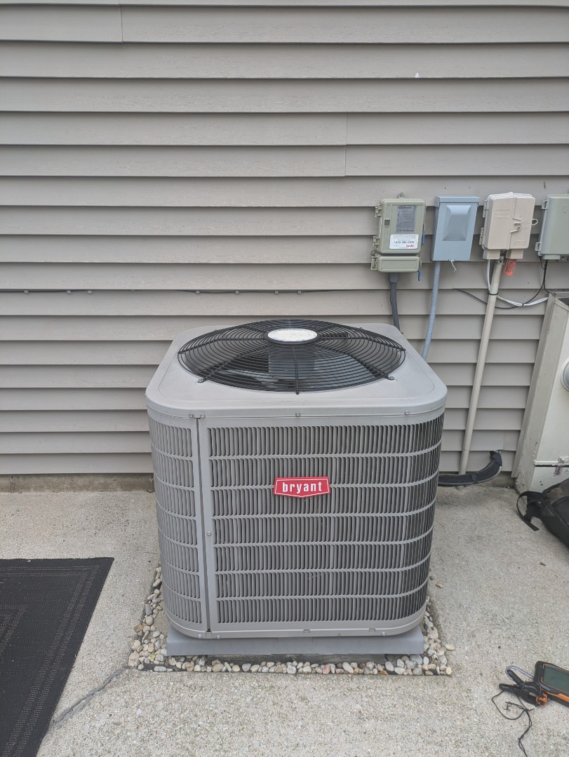 performing maintenance on a high efficiency Bryant system doing deep coil cleaning 