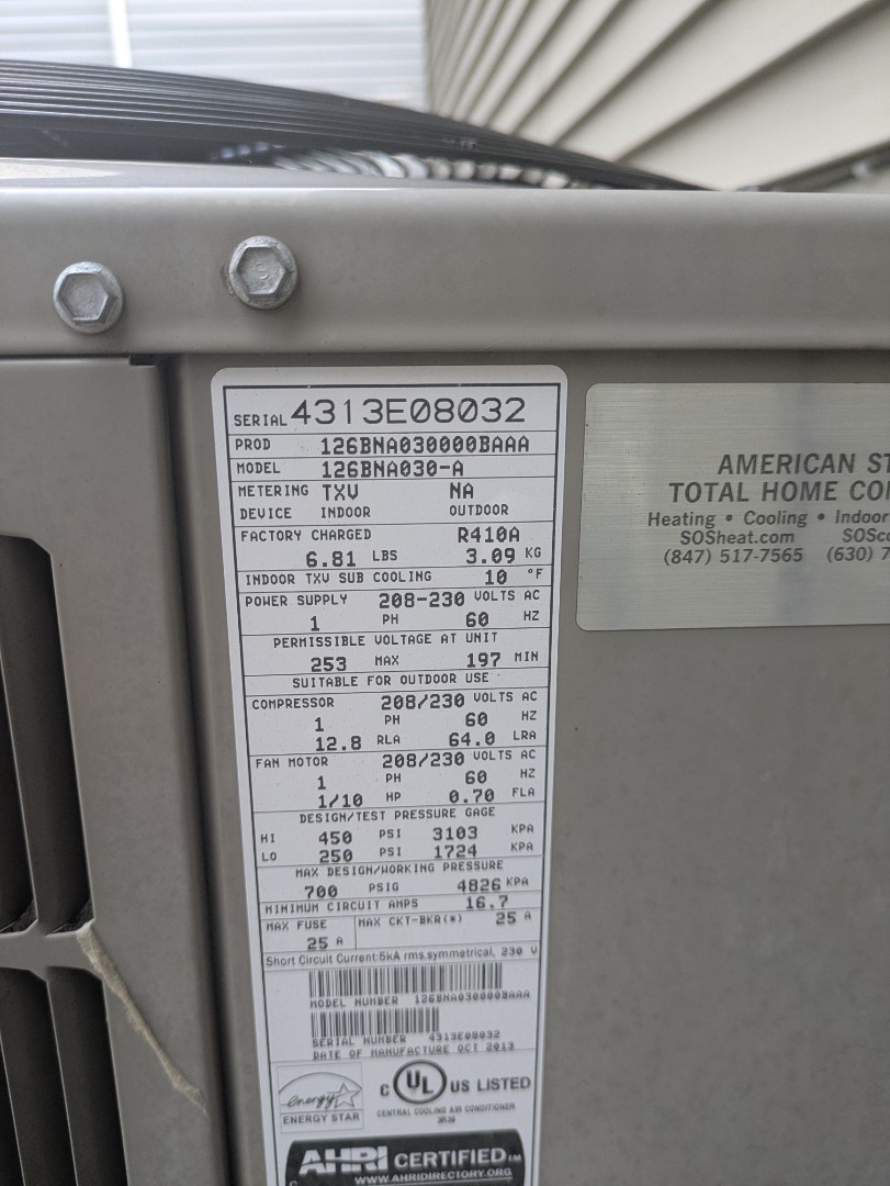 performing maintenance on a high efficiency Bryant system doing deep coil cleaning 