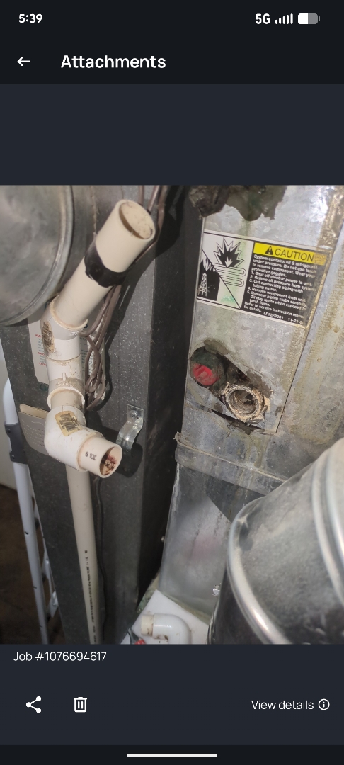 flushing out clogged condenser drain for central air conditioner 