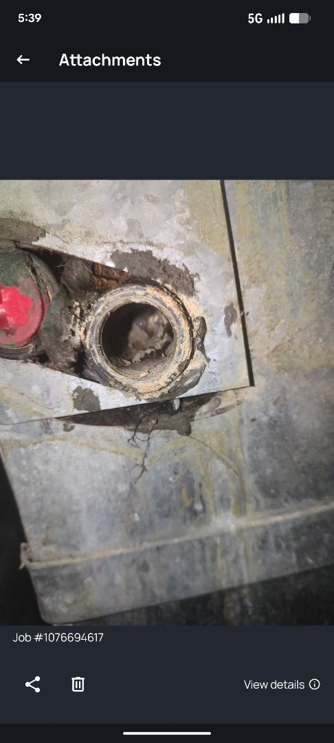 flushing out clogged condenser drain for central air conditioner 