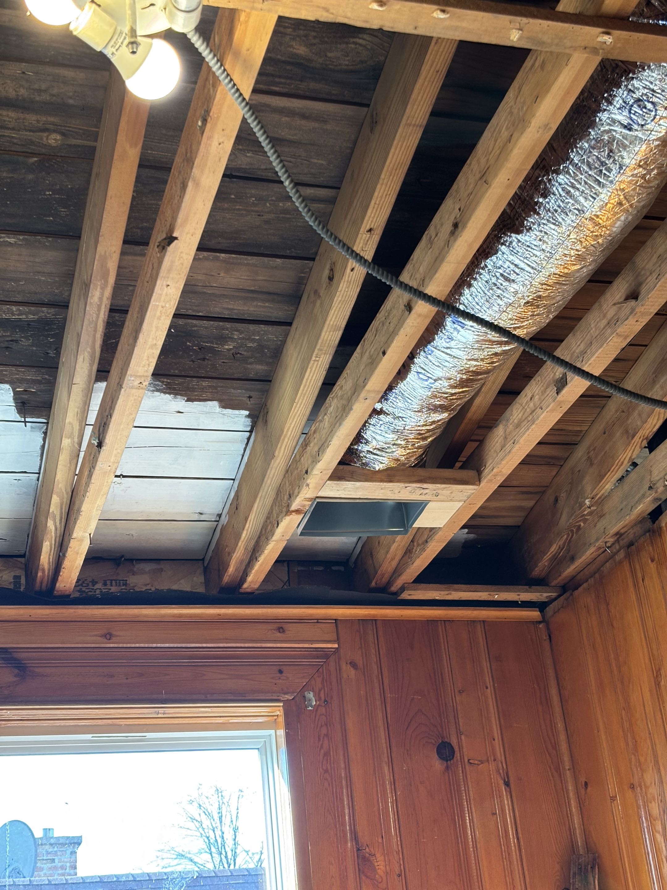 Installing two new supply ductwork from furnace.