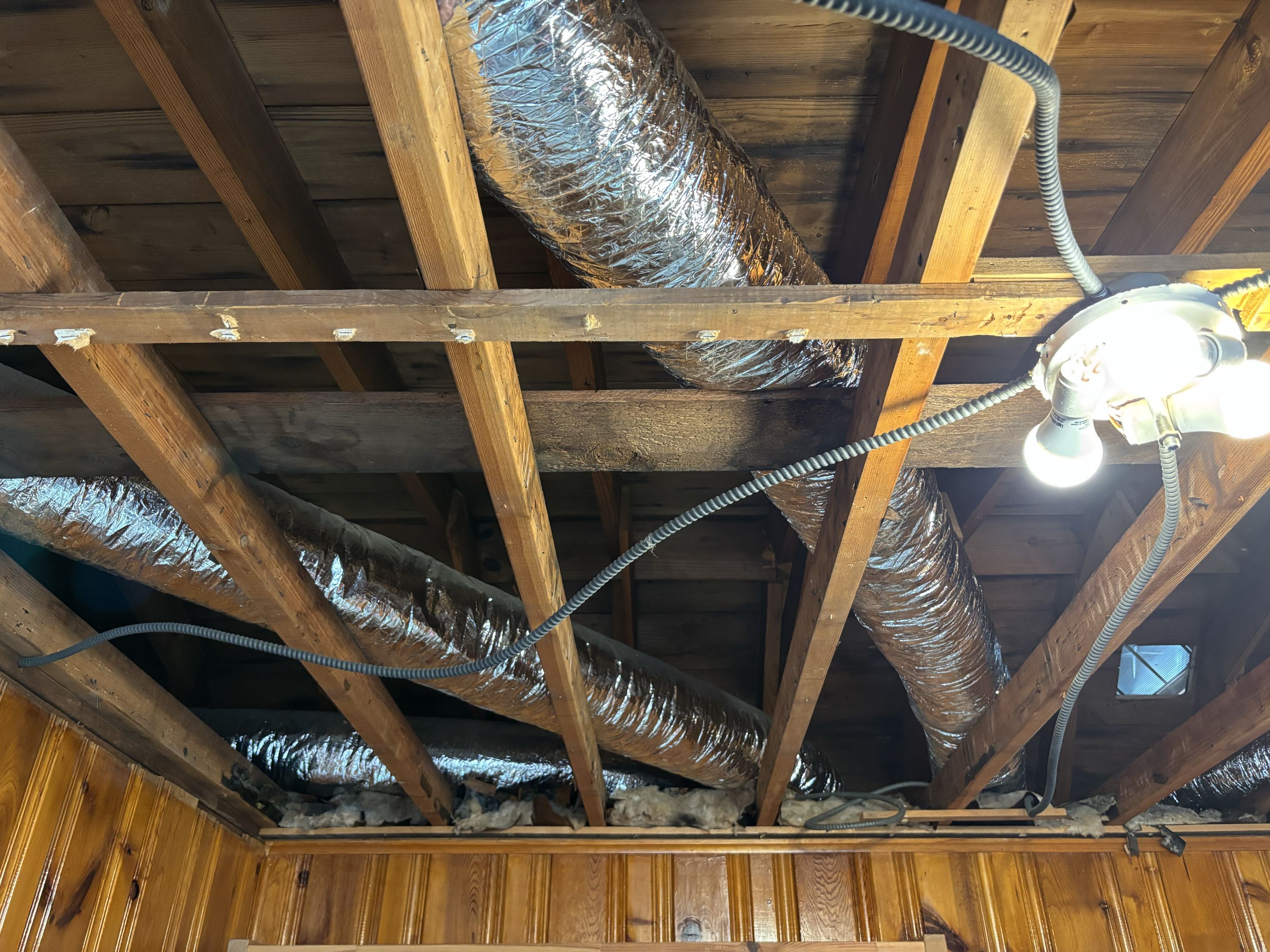Installing two new supply ductwork from furnace.