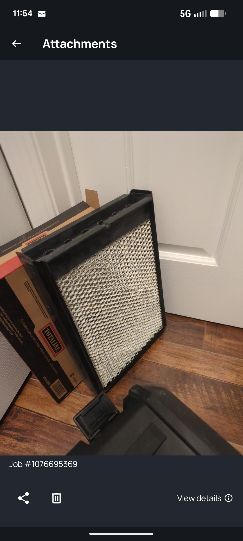 performing maintenance on a Rheem furnace and large fan powered humidifier 