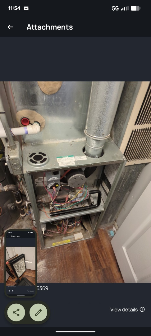 performing maintenance on a Rheem furnace and large fan powered humidifier 