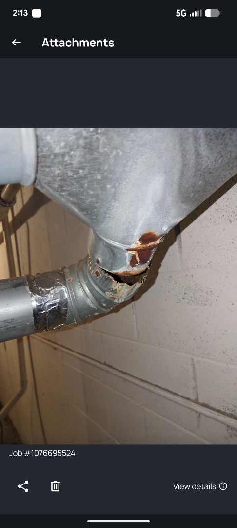 performing maintenance on a comfort Maker furnace and working on flu pipe 