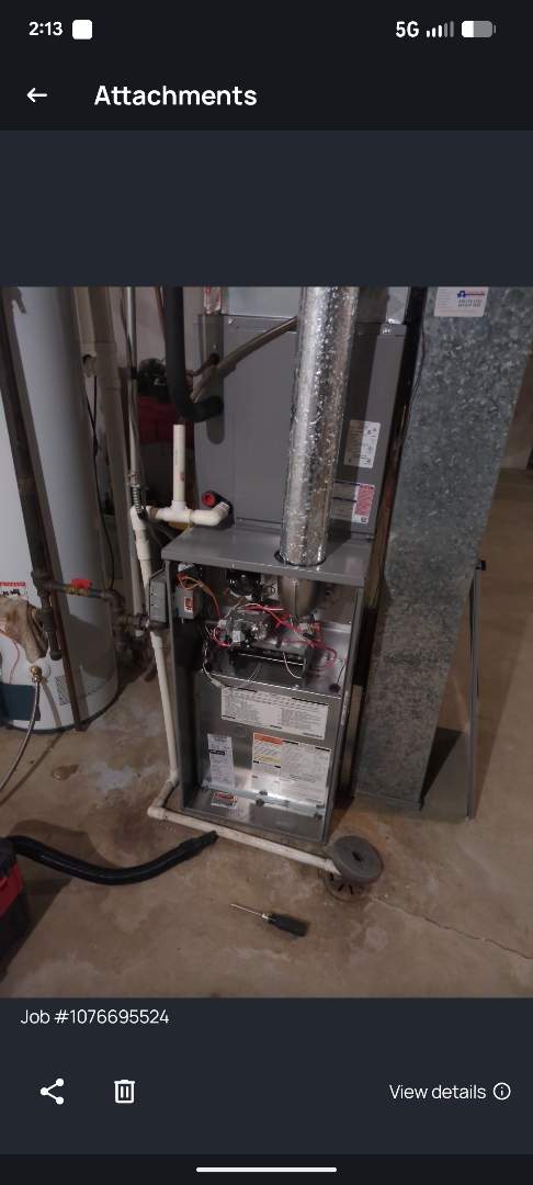 performing maintenance on a comfort Maker furnace and working on flu pipe 