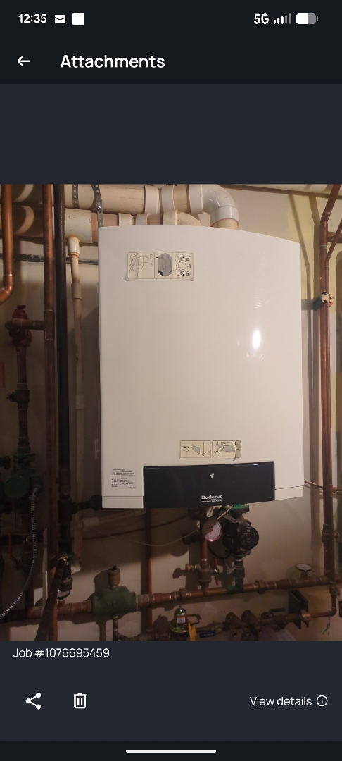 performing maintenance on a tankless boiler and two high efficiency Trane furnaces