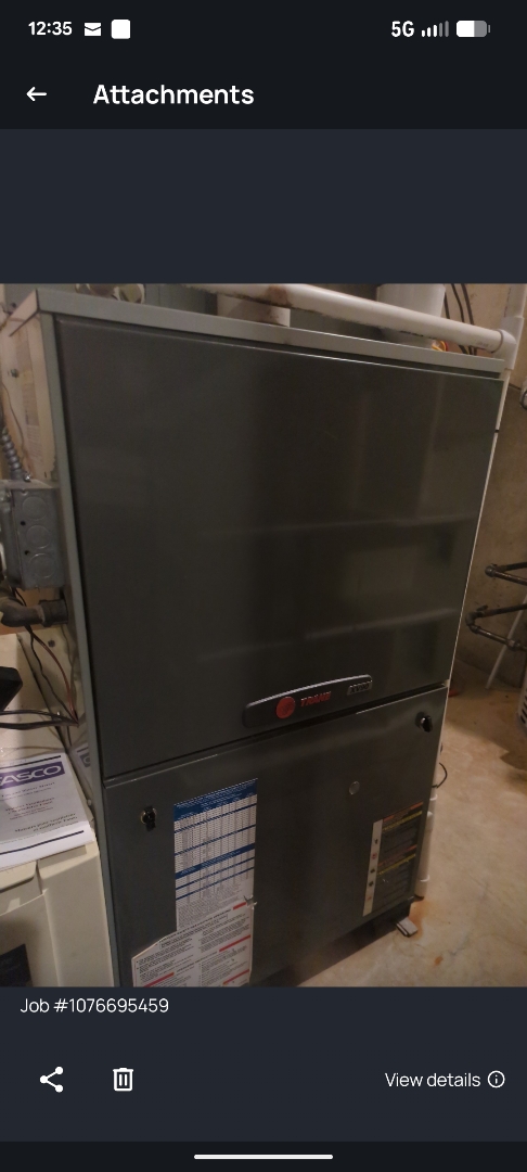 performing maintenance on a tankless boiler and two high efficiency Trane furnaces