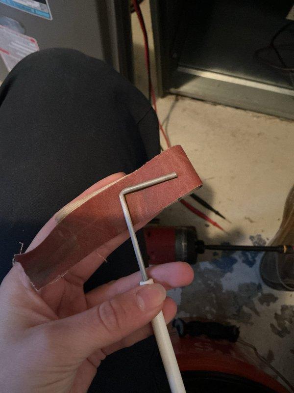 Performed scheduled Air Care Cooling and Heating maintenance service. Accessed and inspected furnace internal components including blower motor assembly, electrical connections, and control modules. Removed and examined L-shaped igniter rod and gasket material during the comprehensive system evaluation.