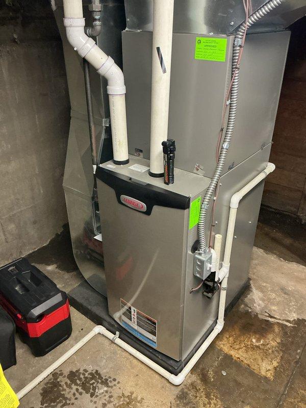 Performed scheduled ComfortGuard Maintenance on Lennox HVAC system located in basement utility room. Completed comprehensive inspection of furnace components, ventilation system, and PVC drainage pipes. Noted minor moisture around unit base; recommended monitoring for potential condensation issues.