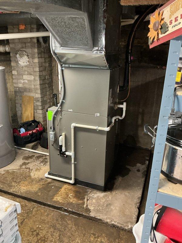 Performed scheduled ComfortGuard Maintenance on Lennox HVAC system located in basement utility room. Completed comprehensive inspection of furnace components, ventilation system, and PVC drainage pipes. Noted minor moisture around unit base; recommended monitoring for potential condensation issues.
