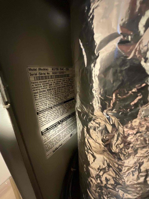 Completed inspection of residential property with existing Gibson furnace (Model KG7SA 060E-*2M) approximately 10 years old. Customer recently purchased home with forced air system and requires addition of air conditioning. Documented current installation including furnace condition, ductwork configuration, and available space in mechanical room where furnace is co-located with water heater. Provided full system estimate for AC addition to existing forced air system with customer requesting installation within next couple weeks.