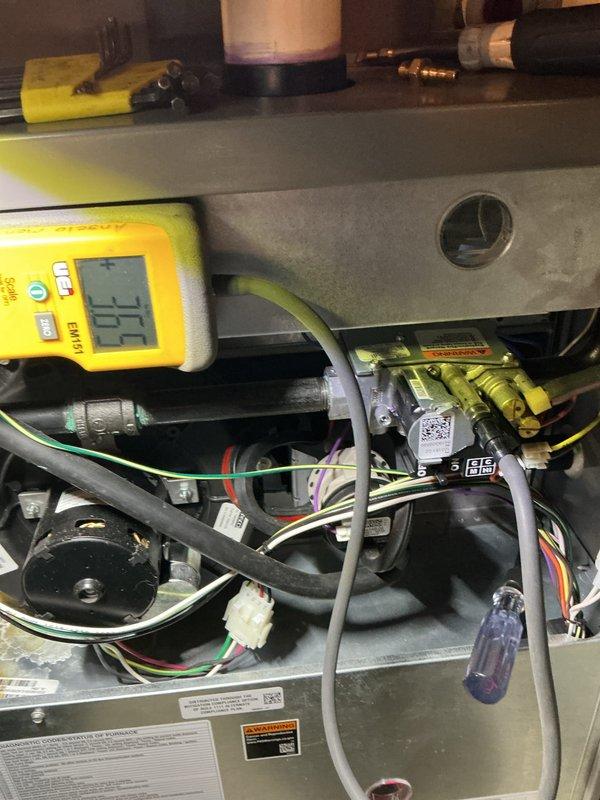 Performed scheduled 5-year Air Handler Maintenance service. Conducted diagnostic testing with Fieldpiece meter showing 111 reading, inspected control board and wiring harnesses for proper connections. Replaced filter and pad while examining gas valve assembly and internal components for proper operation.