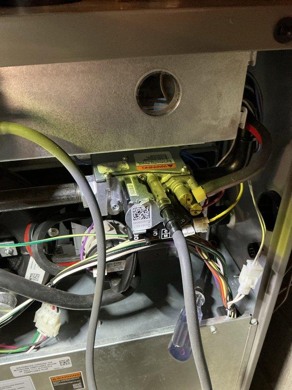 Performed scheduled 5-year Air Handler Maintenance service. Conducted diagnostic testing with Fieldpiece meter showing 111 reading, inspected control board and wiring harnesses for proper connections. Replaced filter and pad while examining gas valve assembly and internal components for proper operation.