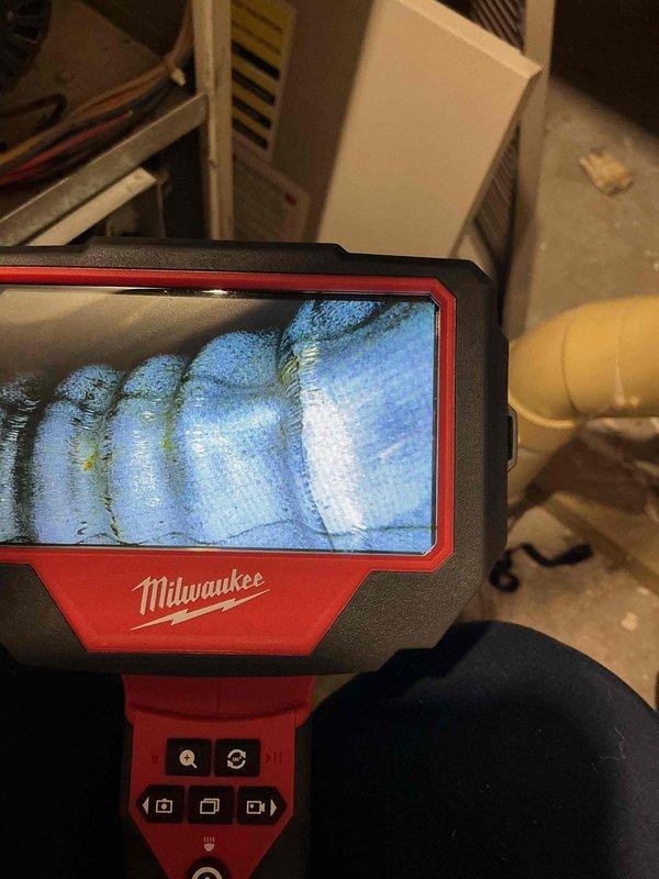 Diagnosed furnace not producing heat using inspection camera to examine heat exchanger and internal components. Identified cracked heat exchanger as root cause of no heat issue. Recommended replacement of heat exchanger or full furnace replacement due to safety concerns and potential carbon monoxide hazards.