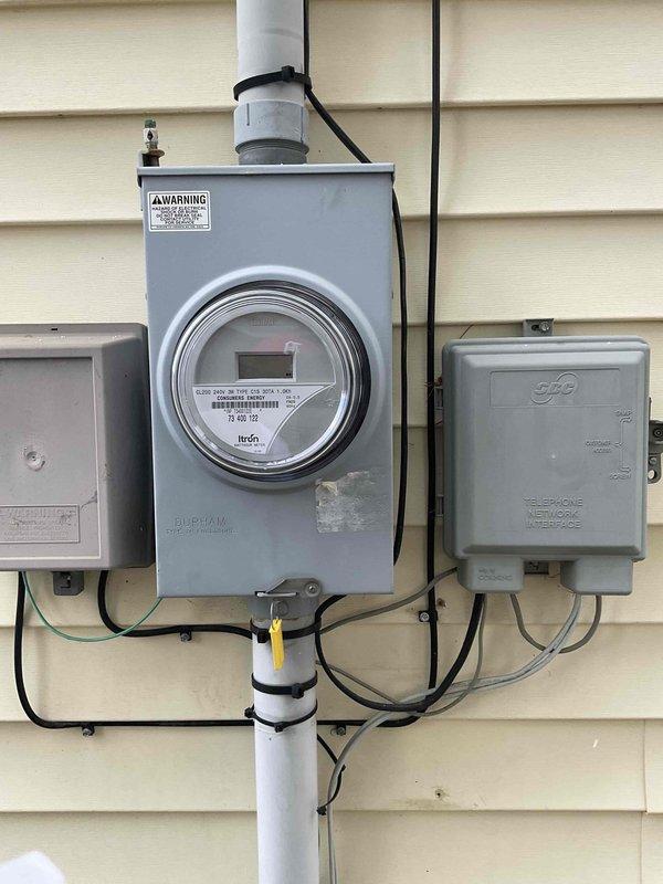 Conducted comprehensive site assessment for potential whole home generator installation, evaluating the existing electrical service meter configuration and surrounding utility connections. Documented the current meter setup and available space for generator placement through detailed photographs. Assessment will inform proper generator sizing and installation requirements for this residential property.