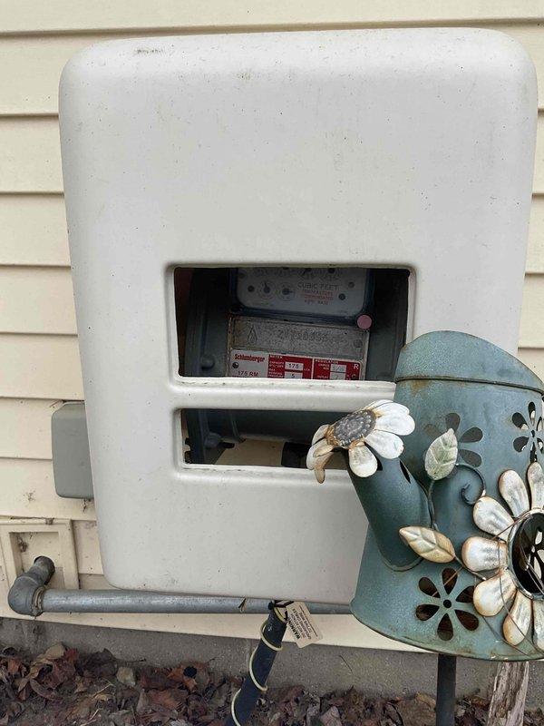 Conducted comprehensive site assessment for potential whole home generator installation, evaluating the existing electrical service meter configuration and surrounding utility connections. Documented the current meter setup and available space for generator placement through detailed photographs. Assessment will inform proper generator sizing and installation requirements for this residential property.