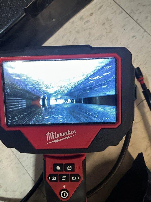 Performed comprehensive furnace maintenance service included with customer's membership. Utilized Milwaukee inspection camera to assess internal components and ductwork for potential issues. Inspected and documented condition of existing air filter, which showed normal accumulation of particulate matter, indicating proper filtration function.