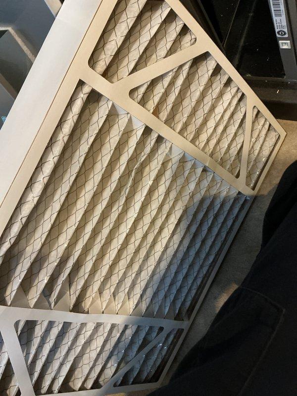 Performed annual maintenance on furnace for Air Care member. Inspected air filter which appeared clean and in good condition. Conducted electrical testing with clamp meter, verifying proper amperage readings (0.00A) and voltage (51.0V) on the system components.