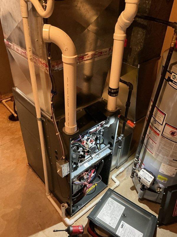 Responded to service call for gas odor at furnace intake valve on a 6-year-old unit. Upon inspection, identified a small leak at the gas valve connection. Tightened connection, applied leak detection solution to verify repair, and tested system operation with normal flame pattern observed at burners. Unit now functioning properly with no detectable gas leaks.