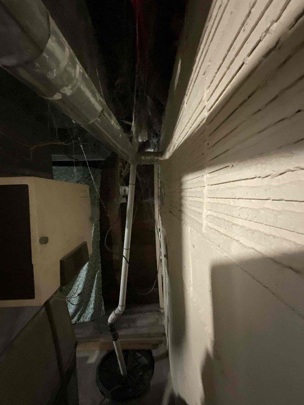 Conducted replacement estimate for 35-year-old furnace and A/C system located in basement. Current equipment is operational but at end of life expectancy. Inspection revealed confined installation space with multiple plumbing lines and ductwork requiring careful consideration for new equipment placement. Noted existing water heater with vertical exhaust system and insulated copper piping that will need to be worked around during replacement.