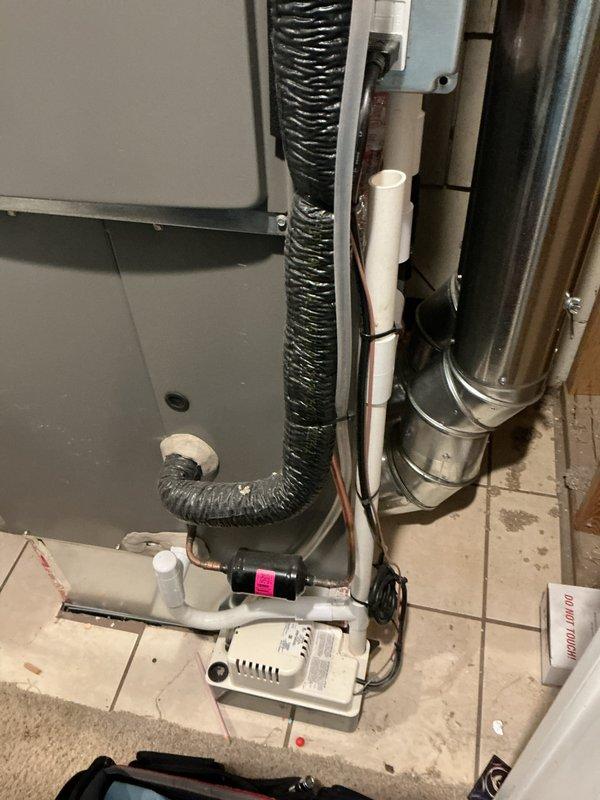 Performed annual furnace maintenance under Air Care membership on a 10-year-old system. Inspected drainage components including PVC condensate lines and condensate pump for proper operation. Examined ductwork connections and verified furnace operation according to manufacturer specifications. System is functioning correctly with no issues identified.