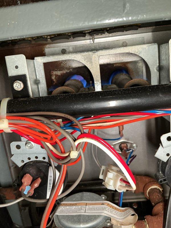 Responded to customer complaint of slow heating performance. Conducted diagnostic inspection of forced air furnace, examining burner assembly and electrical connections. Found normal flame pattern with proper combustion and no significant issues with heat exchanger or control wiring; recommended continued monitoring of system performance and possible thermostat calibration check if heating delays persist.