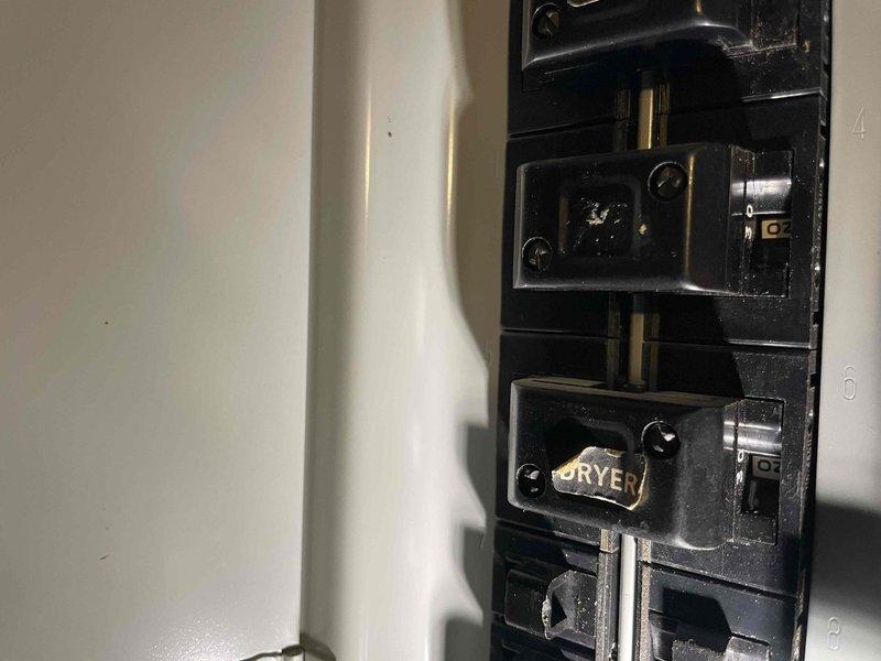 Provided quote for replacement of 30+ year old non-functional furnace and A/C system located in basement (BOGO offer). System evaluation included inspection of electrical panel with proper circuit identification and assessment of existing ductwork configuration, which consists of insulated metal ducts branching from the current Goodman unit, alongside an A.O. Smith water heater in the utility area.