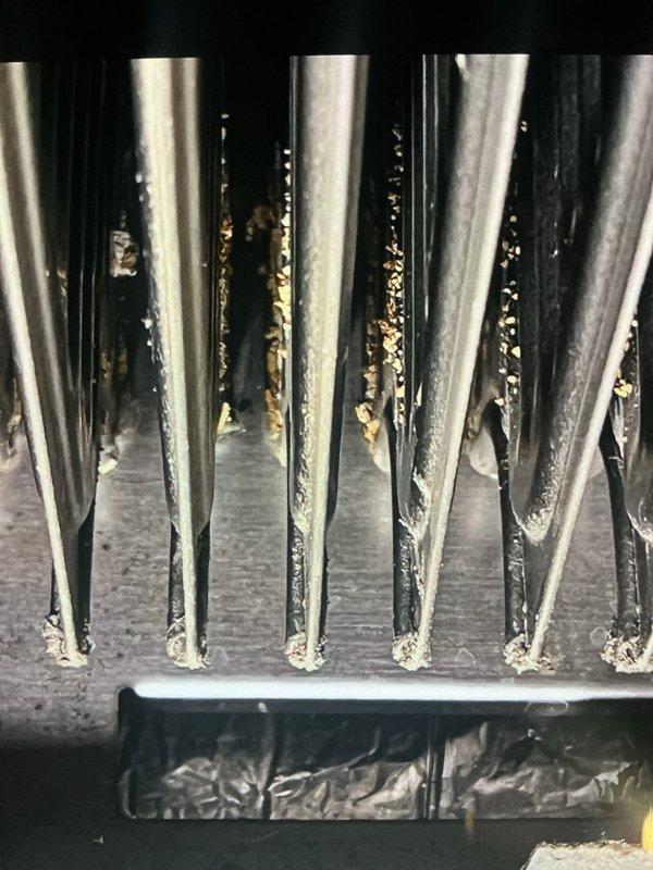 Upon arrival, diagnosed inoperative blower on 19-year-old forced air furnace. Inspection revealed severe accumulation of debris and corrosion on heat exchanger fins, significantly reducing system efficiency. Cleaned accessible components and recommended system replacement due to age and condition of critical components.