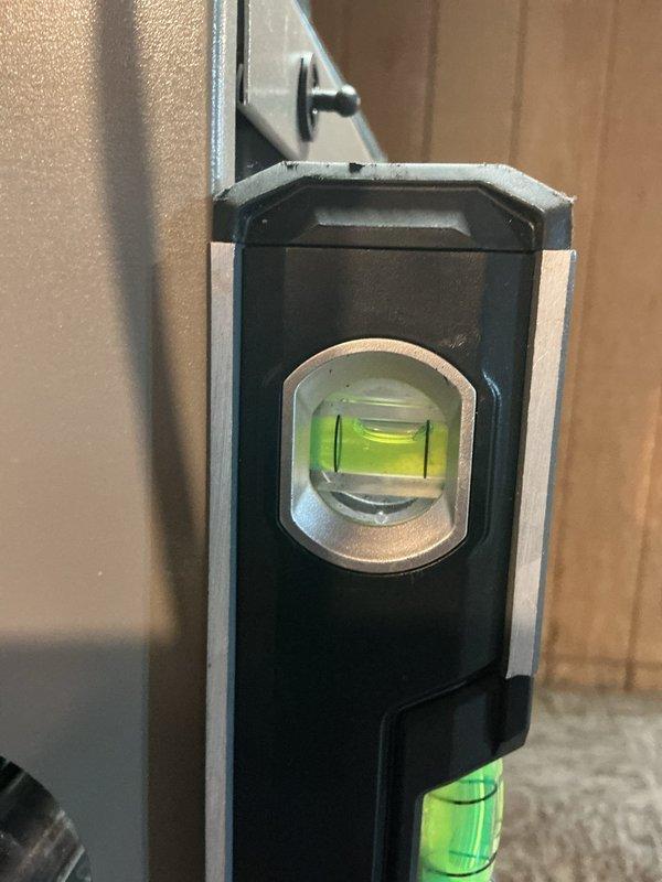 During routine maintenance, identified water leak causing significant corrosion on the interior metal housing of HVAC equipment. Performed diagnostic assessment and documented damage with photographic evidence, including rust formation on electrical components near wiring harness and verified level positioning of the unit.