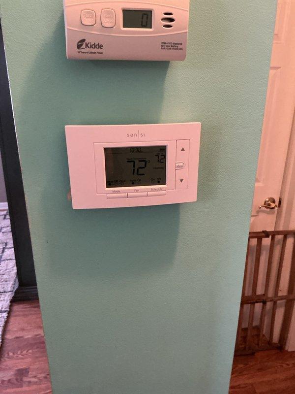 Performed scheduled Air Care Heating maintenance on Lennox furnace system. Inspected and verified proper functioning of Kidde CO detector (reading 0) and Sensi digital thermostat (set to 72°F). Examined furnace unit with PVC venting system, confirming all connections, gas line, and copper piping were secure and in good working condition.