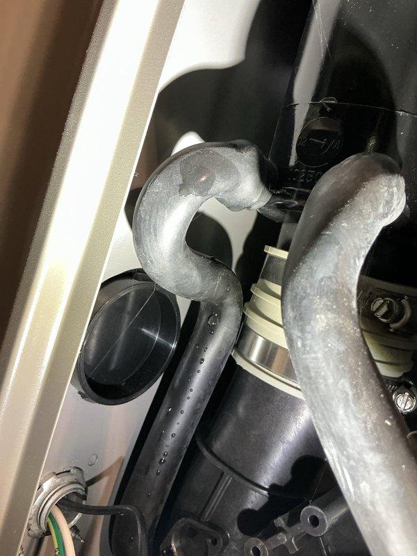 Responded to service call for 3-year-old Lennox furnace with water accumulation on floor. Inspection revealed condensation forming on refrigerant lines due to insufficient insulation. Applied proper insulation to S-curve and adjacent refrigerant pipes to prevent further condensation and water accumulation.