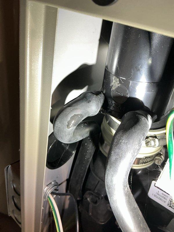 Responded to service call for 3-year-old Lennox furnace with water accumulation on floor. Inspection revealed condensation forming on refrigerant lines due to insufficient insulation. Applied proper insulation to S-curve and adjacent refrigerant pipes to prevent further condensation and water accumulation.