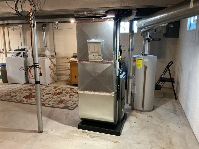 Successfully completed installation of complete HVAC system, including new furnace and air conditioning unit with all required ductwork connections in basement utility area. System was properly configured, tested for optimal performance, and all necessary permits were obtained prior to installation.