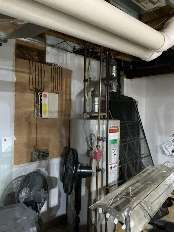 Completed routine Air Care Heating maintenance service (AHM3/1710-2) on HVAC system. Performed visual inspection of furnace interior components including motor, control boards, electrical connections, and wiring harness - all components found in normal working condition with no signs of damage or unusual wear. Inspected mechanical room configuration including water heater and associated plumbing connections.